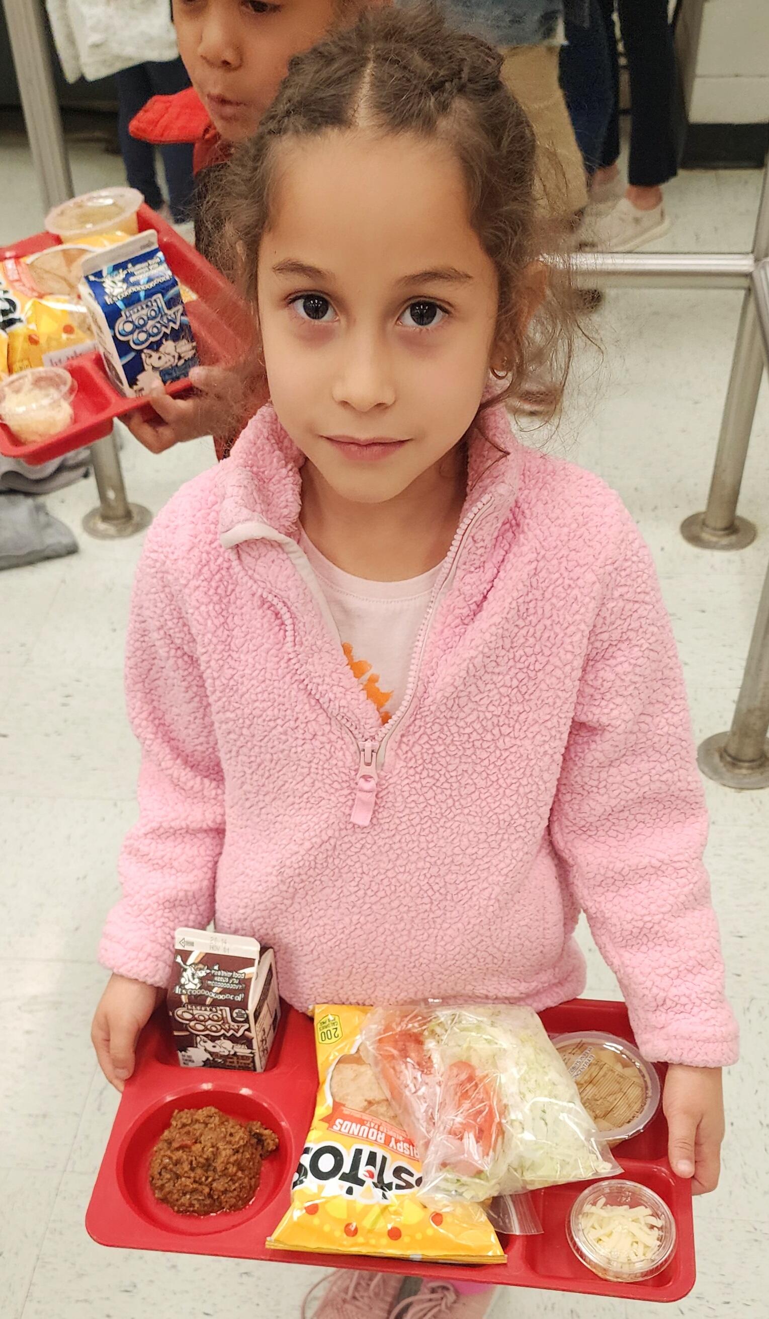 Jennifer Alejo, Kindergarten Student at Cox, with lunch tray